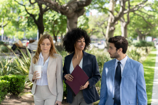 Colleagues having a walking meeting in a park setting